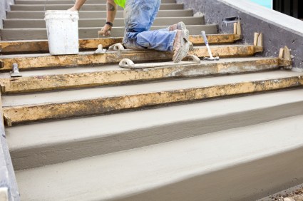 CR Landscape Stonework mason building cement steps in Tyngsboro, MA.